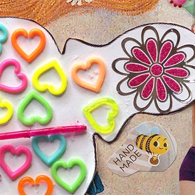 hearts and flower on the paper cutout body