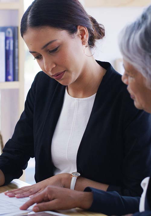 A lawyer giving legal advice to an older woman